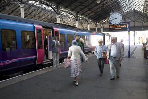 Train and passengers on platform of Scarborough railway station, Yorkshire, England, United