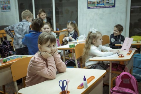 Pupils in a classroom in one of the metro schools in Kharkiv. Classrooms were set up in various
