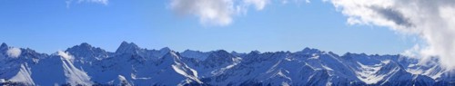 Alpine panorama with snow-covered mountain peaks in winter. Taken in the ski resort of Serfaus Fiss
