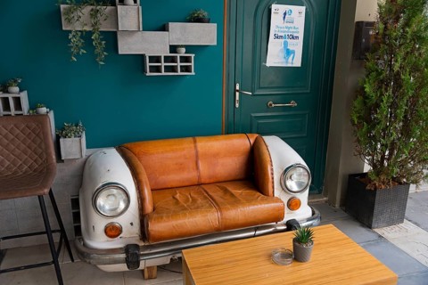 A couch created from the front part of a vintage car stands in a café, Alexandroupoli,