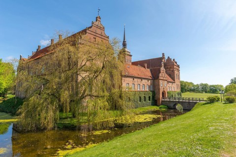 Holckenhavn Castle, hotel, brick building, castle church, castle moat, bridge, entrance gate, park,