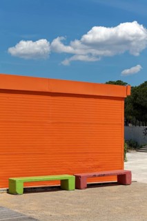Orange painted house and light green bench, ticket counter, Paleo Falliro, Athens, Attica, Greece,