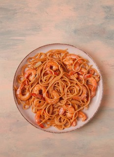 Spaghetti with king shrimps, with spices, top view, selective focus, homemade, no people