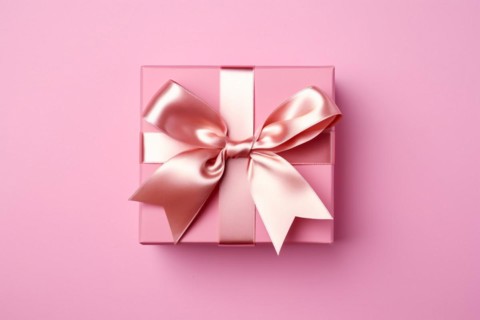 Top view of pink gift box with silk bow on pink studio background. KI generiert, generiert AI