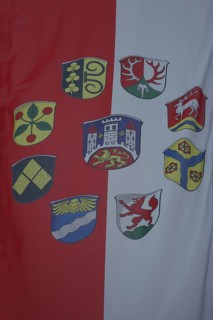 City flag and city districts, city coat of arms with lion figure and three towers, red, white,
