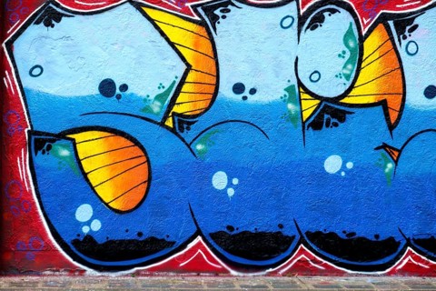 Detailed graffiti in blue and orange with vivid colour elements on a wall, Landau,