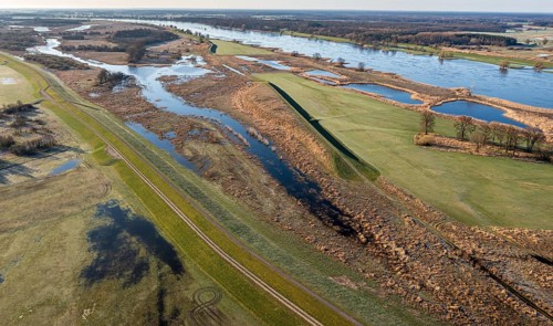 Aerial view of new dyke construction further inlands than the old dyke, flood protection, river