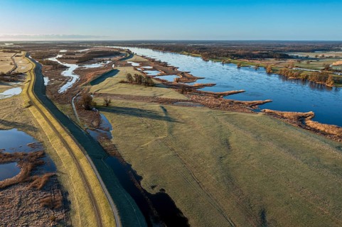 Aerial view of new dyke construction further inlands than the old dyke, flood protection, river