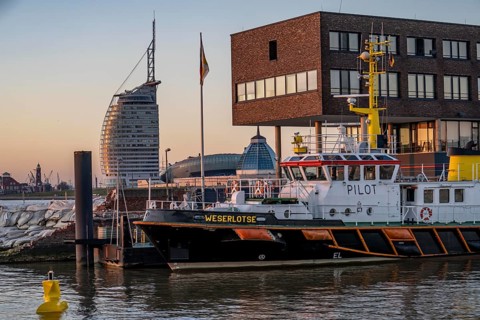 Skyline of Bremerhaven, seen over the Weser, Atlantic Sail City Hotel, Klimahaus, pilot ship in the