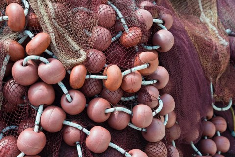 Close-up of fishing nets and orange buoys intertwined, Poros, Poros Island, Saronic Islands,