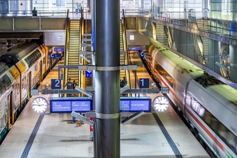 Platform at Gesundbrunnen station with an ICE train passing through: Caution train traffic sign.