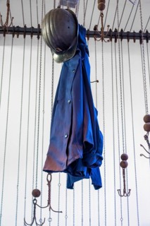 Changing room with pulleys and chains to hoist coal miners clothes at Le Bois du Cazier, coal