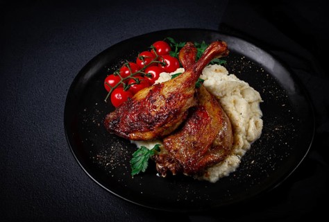 Fried duck shank, cauliflower puree, cherry tomatoes, homemade, no people