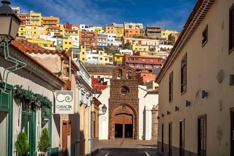 Town view with colourful houses and the Church of the Assumption of the Virgin Mary or Nuestra