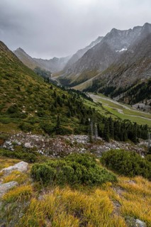 Green mountain valley with river and steep mountain peaks, Chong Kyzyl Suu Valley, Terskey Ala Too,