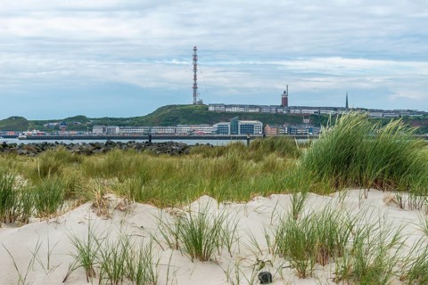 View from the dune to the offshore island of Heligoland, hotels and guesthouses in the lowlands and