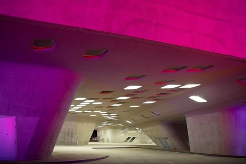 The colourfully illuminated phæno building, an experimental landscape and a science centre in the