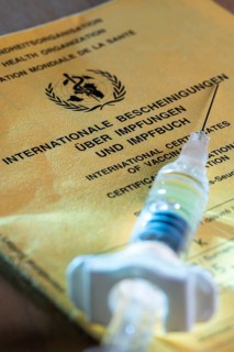 Symbolic photo vaccination, vaccination certificate, syringe with vaccine