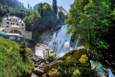 Waterfall of the Gasteiner Ache in the centre with historic power station, Bad Gastein, Gastein
