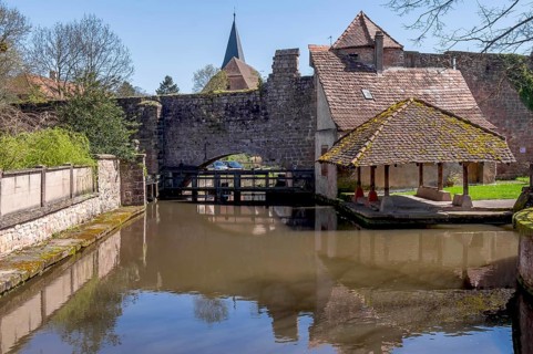 Le Bruch, old town wall with weir and historic wash house on the Lauter, Wissembourg, Northern