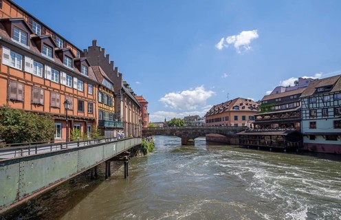 Rows of houses on the banks of the River Ill with the Pont Saint Martin, Strasbourg, Alsace,
