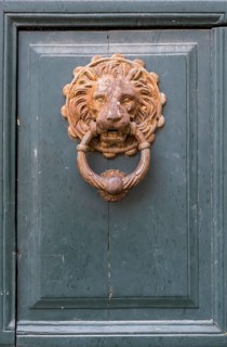 Lion's head as a door knocker, Galatina, Apulia, Italy, Europe