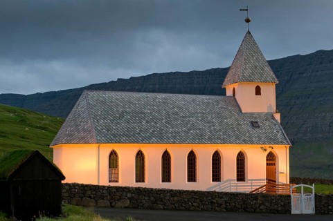 Illuminated church of Vidareidi, Vidoy Island, Viðareiði, Viðoy Island, Faroe Islands, Denmark,