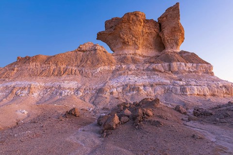 Eroded rock formations on a fossilised reef edge, at blue hour, Huqf stone desert, Arabian