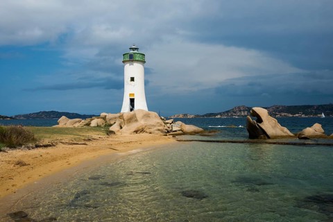Lighthouse with beach and bizarre granite rocks, Spiaggia Porto Faro, Faro di Punta Palau, Palau,