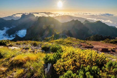View of mountains over clouds from Pico Ruivo on sunset. Madeira island, Portugal, Europe