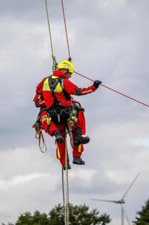 Height rescuers from the Gelsenkirchen fire brigade practise abseiling from a wind turbine from a