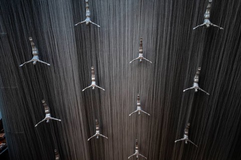 Interior view, The Waterfall, artificial indoor waterfall with life-size jumper sculptures,
