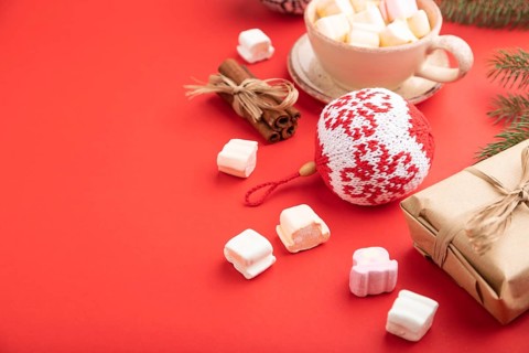 Christmas or New Year composition. Decorations, box, cinnamon, knitted balls, fir and spruce