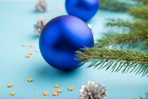 Christmas or New Year composition. Decorations, blue balls, cones, fir and spruce branches, on a