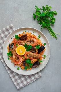Seafood paella, shrimp and mussels risotto, rice, homemade, top view, no people