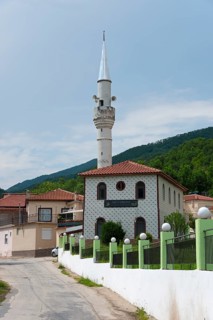A whitewashed mosque with a minaret along a quiet street, Melivia, Melivoia, centre of the Pomaks,