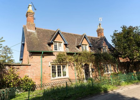 Attractive detached red brick historic house in village of Compton Bassett, Wiltshire, England, UK