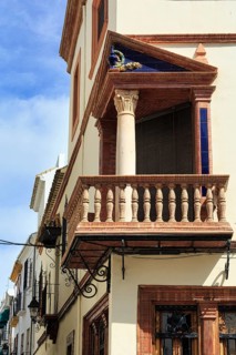 Decorated wooden balcony, corner balcony, façade detail in the historic centre, Priego de Cordoba,