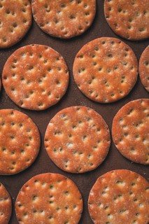 Crispbread, round, with salt and herbs, top view, food concept, no people