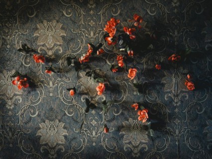 Wallpaper with plastic flowers in a house in Voloska Balakliia. The village is close to the front