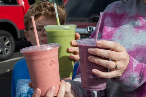Wheat Ridge, Colorado, Customers display the smoothies they purchased at the Twisted Smoothie