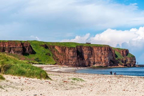View over the Nordstrand, red sandstone cliff on the offshore island of Heligoland, North Sea,