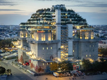 Aerial view of the Hamburg Bunker with green terraces and modern architecture in the evening