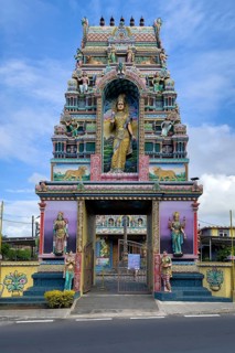 Portal tower with statues of deities Statues of deities at the entrance to Hindu temple Shri Sri