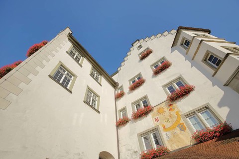 Historic gate castle with stepped gable, oriel and wall painting, wall painting, view upwards, town
