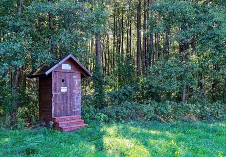 Wooden toilet block in a car park for hikers in the south of the Wigry National Park near Krusznik