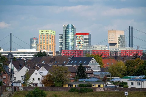 The skyline of Düsseldorf, with the skyscrapers in the Media Harbour, Rhine bridges, in front
