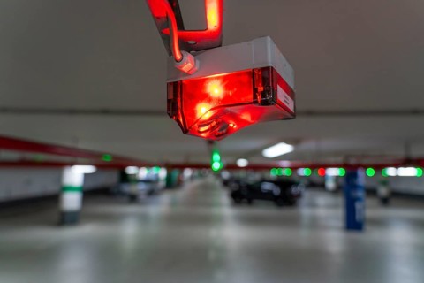 Underground car parks, multi-storey car parks, red or green lamps on the ceiling, show drivers