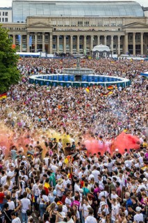 UEFA European Football Championship. Enthusiastic fans with pyrotechnics, public viewing in the