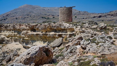 Medieval ruin on a rocky terrain with a clear blue sky, windmill, ruin, near Lindos, Lindos,